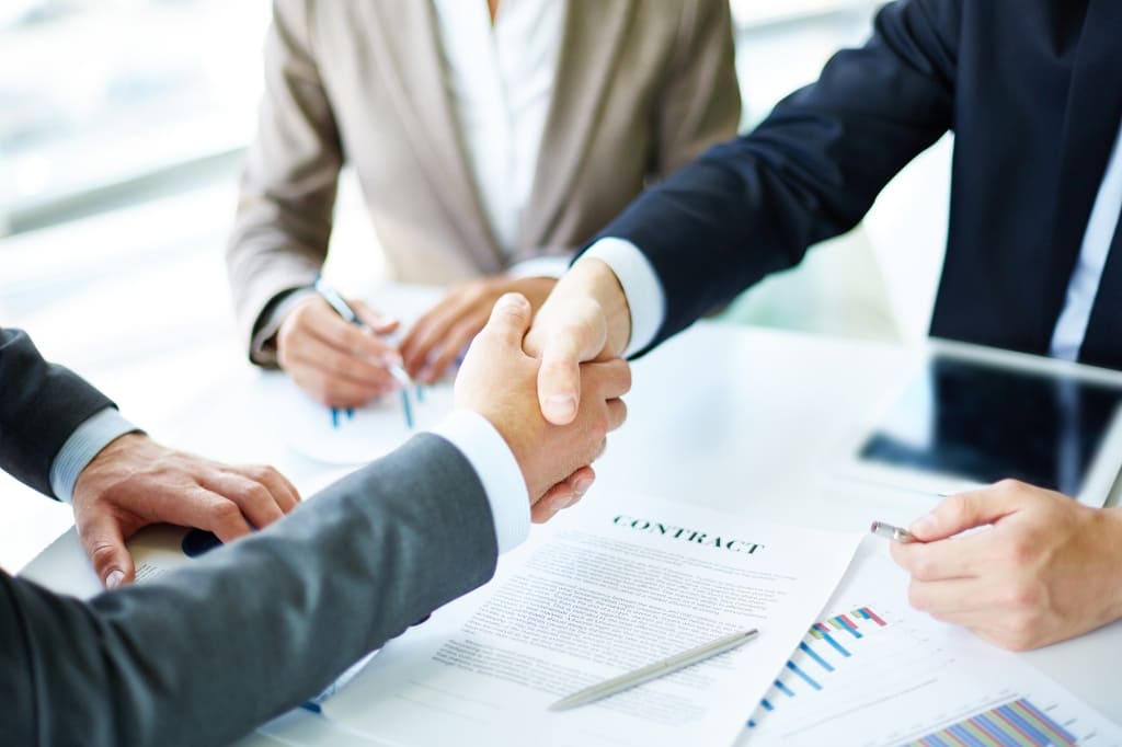 Lawyer Shaking Hands With His Client